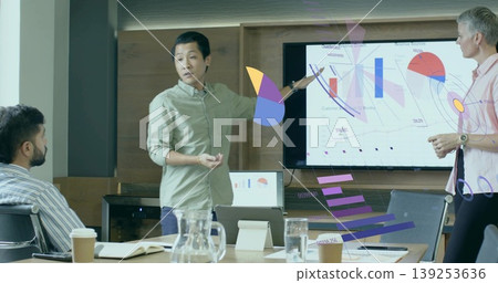 Presenting Asian man wearing shirt explaining charts on screen in conference room, with pitcher Presenting Asian man wearing shirt explaining charts on screen in conference room, with pitcher 139253636