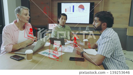 Analyzing business professionals reviewing malware alerts on charts and devices in conference room Analyzing business professionals reviewing malware alerts on charts and devices in conference room 139253646