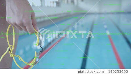 Holding female swimmer hand gripping yellow goggles at pool edge, with red-white lanes, copy space Holding female swimmer hand gripping yellow goggles at pool edge, with red-white lanes, copy space 139253690