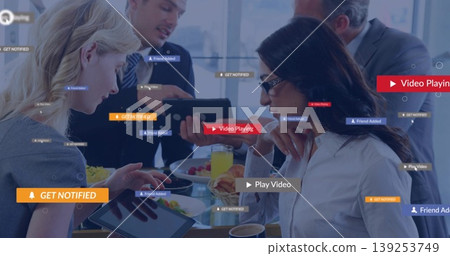 Woman wearing shirt tapping tablet, sharing croissant in office, with digital overlays, copy space Woman wearing shirt tapping tablet, sharing croissant in office, with digital overlays, copy space 139253749