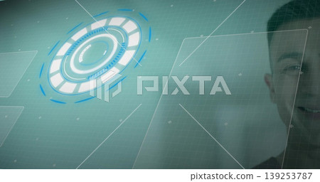 Interacting mid adult Indian man controlling grid with HUD panels and crosshair markers, copy space Interacting mid adult Indian man controlling grid with HUD panels and crosshair markers, copy space 139253787