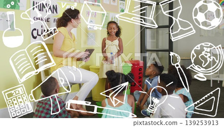 Presenting Hispanic girl holding water bottle speaking to classmates in class, with recycling bins Presenting Hispanic girl holding water bottle speaking to classmates in class, with recycling bins 139253913