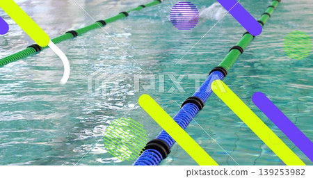 Displaying green-blue lane divider rope floating in turquoise pool water, showing black spacers Displaying green-blue lane divider rope floating in turquoise pool water, showing black spacers 139253982