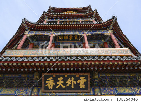 Bottom view of a tower of ancient Buddhist Foxiange Temple in Yiheyuan Park in Beijing, China Bottom view of a tower of ancient Buddhist Foxiange Temple in Yiheyuan Park in Beijing, China 139254040