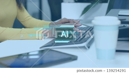 Typing man wearing yellow top showing AI graphic above wireless keyboard, coffee cup at office desk Typing man wearing yellow top showing AI graphic above wireless keyboard, coffee cup at office desk 139254291
