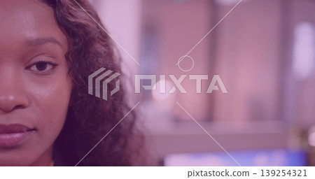 Facing camera, woman in yellow top at desk, screen blur, pastel lights, copy space Facing camera, woman in yellow top at desk, screen blur, pastel lights, copy space 139254321