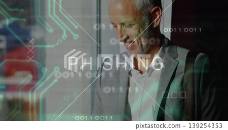 Glancing senior businessman in grey suit in office lobby, with phishing graphic, copy space Glancing senior businessman in grey suit in office lobby, with phishing graphic, copy space 139254353