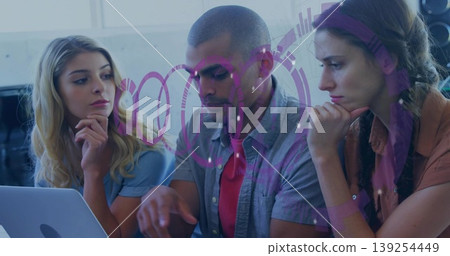 Three colleagues sitting on office chairs reviewing data on laptop at office table, with speaker Three colleagues sitting on office chairs reviewing data on laptop at office table, with speaker 139254449