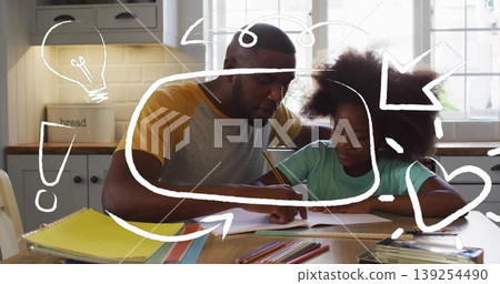 Parent and school-age girl working on homework in kitchen, with notebooks and colored pencils Parent and school-age girl working on homework in kitchen, with notebooks and colored pencils 139254490