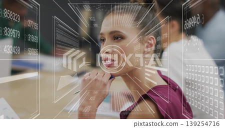 Professional analyzing data with stylus and laptop at table in office, with holographic panels Professional analyzing data with stylus and laptop at table in office, with holographic panels 139254716