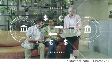 Collaborating professionals analyzing currency exchange in office lounge with laptop plant shelves Collaborating professionals analyzing currency exchange in office lounge with laptop plant shelves 139254735