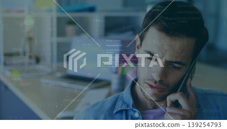 Speaking Hispanic professional holding smartphone to ear in home office, with laptop, copy space Speaking Hispanic professional holding smartphone to ear in home office, with laptop, copy space 139254793