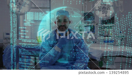 Gowned gloved doctor reviewing data in imaging suite, with CT scanner hologram and code overlay Gowned gloved doctor reviewing data in imaging suite, with CT scanner hologram and code overlay 139254895