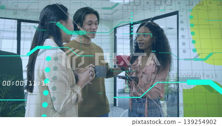 Holding coffee mugs, three professionals chatting in office breakroom, with teal data overlays 139254902