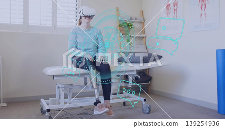 Using VR headset and prosthetic leg woman training on bench in rehab clinic with holographic icons Using VR headset and prosthetic leg woman training on bench in rehab clinic with holographic icons 139254936