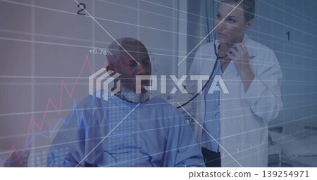 Doctor in lab coat listening with stethoscope on gowned patient in exam room, with graph overlays 139254971