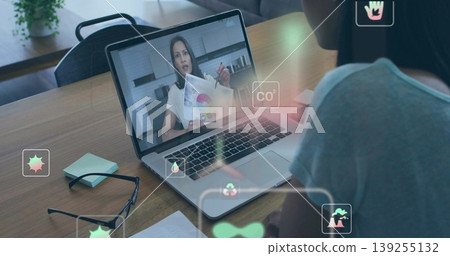 Joining remote consultant presenting color charts on laptop at home office, with eyeglasses and pen Joining remote consultant presenting color charts on laptop at home office, with eyeglasses and pen 139255132