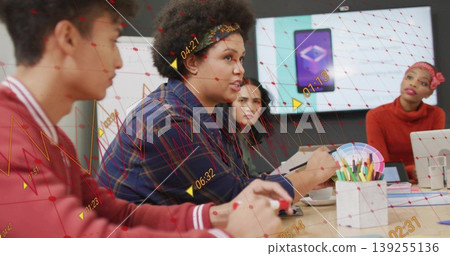 Talking curly-haired woman pointing with pen in modern office conference room with color swatch fan Talking curly-haired woman pointing with pen in modern office conference room with color swatch fan 139255136