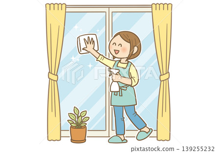 A young woman smiling while cleaning windows - Image of glass cleaning and housework 139255232