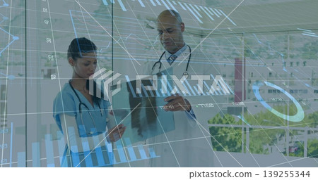 Reviewing nurse and doctor wearing stethoscopes examining medical file in office, with data graphs Reviewing nurse and doctor wearing stethoscopes examining medical file in office, with data graphs 139255344