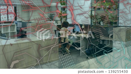 Working woman using keyboard and mouse at modern office desk, with laptop dual monitors and plants Working woman using keyboard and mouse at modern office desk, with laptop dual monitors and plants 139255430