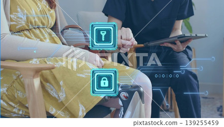 Holding hands patient and provider in scrubs consulting in clinic with security icons, copy space Holding hands patient and provider in scrubs consulting in clinic with security icons, copy space 139255459