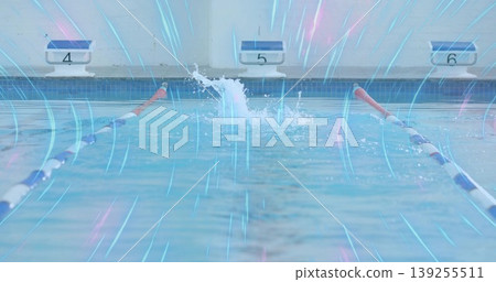 Erupting water splash sending ripples at competition pool, with lane ropes and blocks 4 5 6 Erupting water splash sending ripples at competition pool, with lane ropes and blocks 4 5 6 139255511