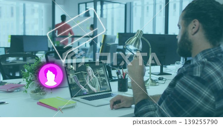 Typing bearded man in plaid shirt working at open-plan office, with laptop, brass lamp, copy space Typing bearded man in plaid shirt working at open-plan office, with laptop, brass lamp, copy space 139255790