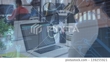 Typing woman in business shirt entering code in open-plan office, with desk lamp and potted plant Typing woman in business shirt entering code in open-plan office, with desk lamp and potted plant 139255921