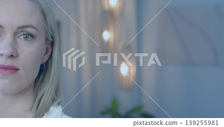 Gazing thoughtfully mid adult woman turning her head in office, with wooden sconces, copy space Gazing thoughtfully mid adult woman turning her head in office, with wooden sconces, copy space 139255981