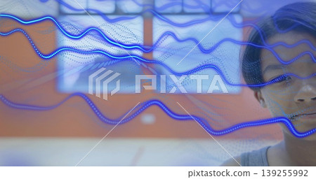 Standing boy in gray tank top facing red-orange exhibit wall, with floating blue waves, copy space Standing boy in gray tank top facing red-orange exhibit wall, with floating blue waves, copy space 139255992