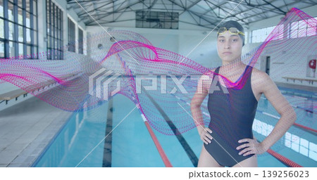 Adjusting goggles swimmer wearing racing suit on pool deck, with digital wave graphic, copy space Adjusting goggles swimmer wearing racing suit on pool deck, with digital wave graphic, copy space 139256023