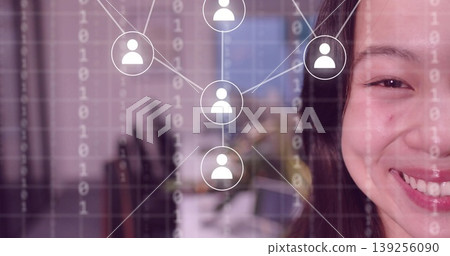 Smiling Chinese woman showing half face at office, network icons, binary code overlay, copy space Smiling Chinese woman showing half face at office, network icons, binary code overlay, copy space 139256090