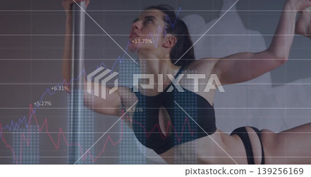Athlete performing horizontal pole hold in studio with line charts, bar graphs, percentage labels Athlete performing horizontal pole hold in studio with line charts, bar graphs, percentage labels 139256169