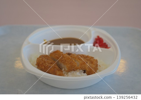 Katsu curry served in a disposable container Katsu curry served in a disposable container 139256432