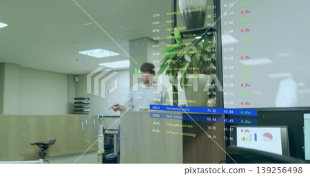 Two presenters in business attire presenting in meeting room with lectern and stock market data Two presenters in business attire presenting in meeting room with lectern and stock market data 139256498