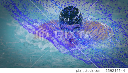 Propelling male swimmer wearing swim cap and goggles through pool water, creating splash droplets Propelling male swimmer wearing swim cap and goggles through pool water, creating splash droplets 139256544