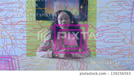 Sitting woman wearing pink blazer positioning hands on wooden table in office, with circuit overlay Sitting woman wearing pink blazer positioning hands on wooden table in office, with circuit overlay 139256563