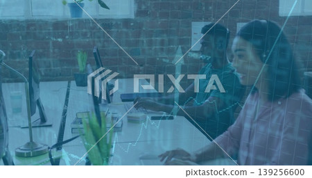 Typing woman in pink shirt working at keyboard on office desk with stock overlay, copy space 139256600