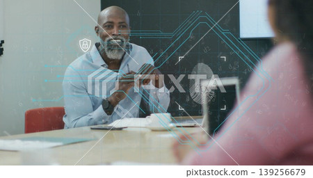 IT consultant in shirt discussing biometric security in office, with fingerprint overlay graphics 139256679