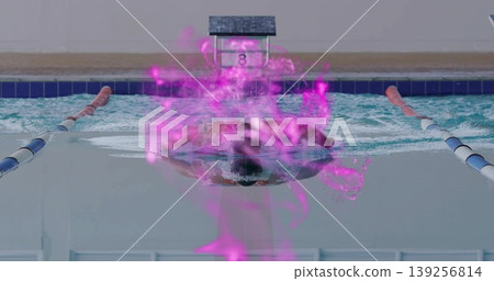 Swimming butterfly stroke cutting through water near lane ropes, block 8, with purple digital glow 139256814