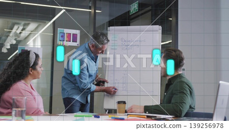 Sketching mature adult man drawing bar graph on flipchart at conference room with markers 139256978