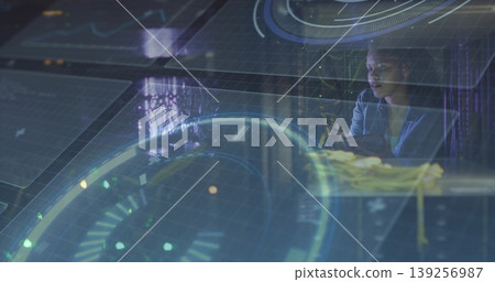 Interacting woman wearing shirt and glasses with holograms at console workstation, copy space Interacting woman wearing shirt and glasses with holograms at console workstation, copy space 139256987