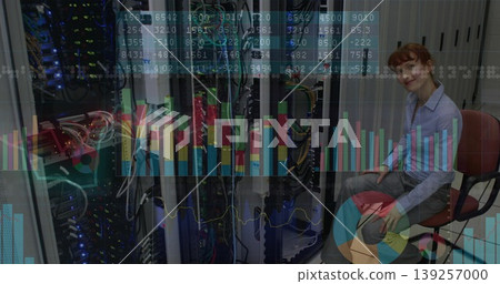 Sitting engineer wearing shirt in data center aisle, with server racks and charts, copy space Sitting engineer wearing shirt in data center aisle, with server racks and charts, copy space 139257000