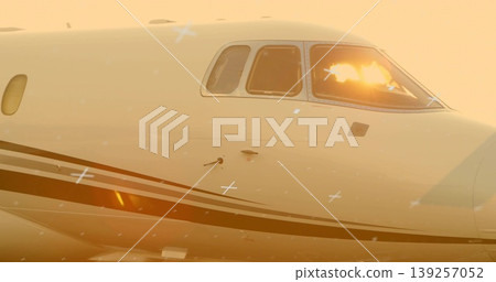 Showing jet fuselage and cockpit windows reflecting golden-hour light on tarmac, with sensors Showing jet fuselage and cockpit windows reflecting golden-hour light on tarmac, with sensors 139257052