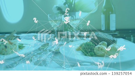 Floating currency network hovering above jet cabin dining table, with gourmet plates and cutlery Floating currency network hovering above jet cabin dining table, with gourmet plates and cutlery 139257054