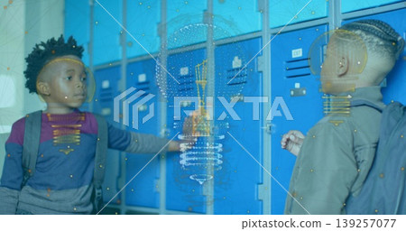 Reaching locker door, two boys interacting in school hallway, with backpacks and blue lockers Reaching locker door, two boys interacting in school hallway, with backpacks and blue lockers 139257077