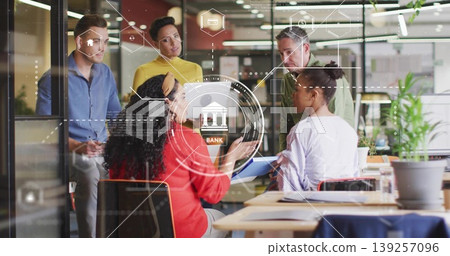 Gesturing woman in red blazer presenting AR banking and home icons in office with laptop, tablet Gesturing woman in red blazer presenting AR banking and home icons in office with laptop, tablet 139257096
