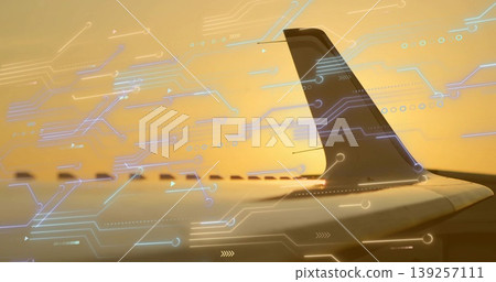Displaying tail fin and wing through window at cruising altitude, with digital overlays, copy space Displaying tail fin and wing through window at cruising altitude, with digital overlays, copy space 139257111