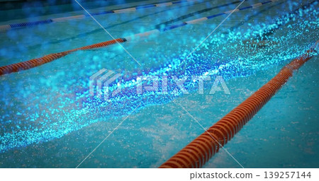 Floating lane-dividing rope gliding across pool surface, with turquoise water sparkle, copy space 139257144